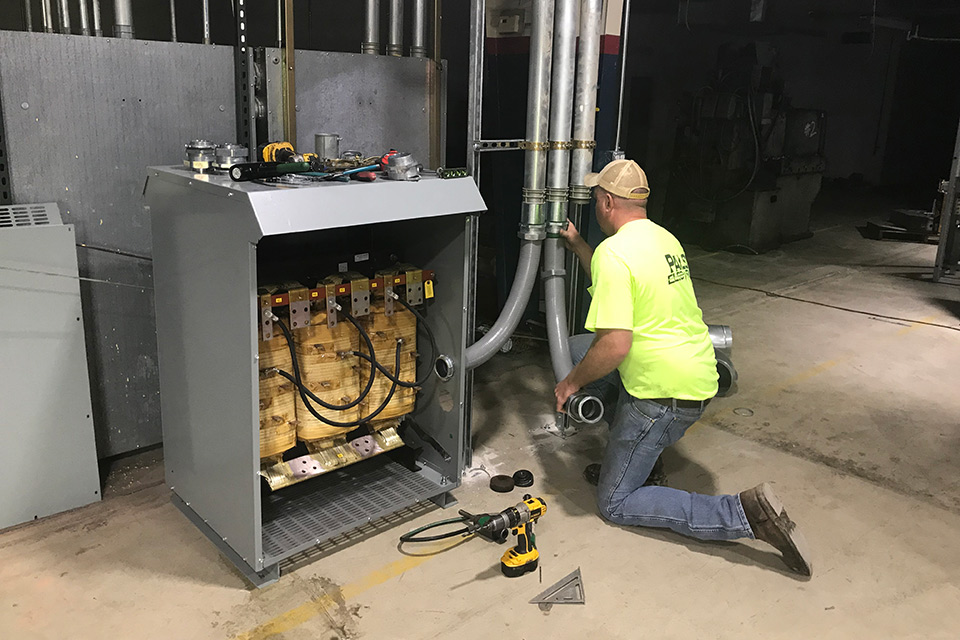Pals electrician working on a commercial electric project