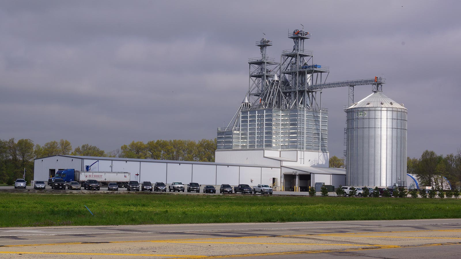 view of a feed mill from the highway