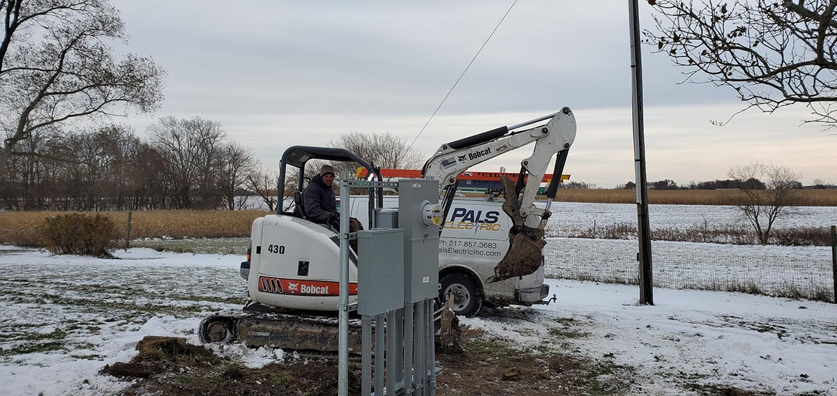 Pals Electric electrician working on outside residential service panel