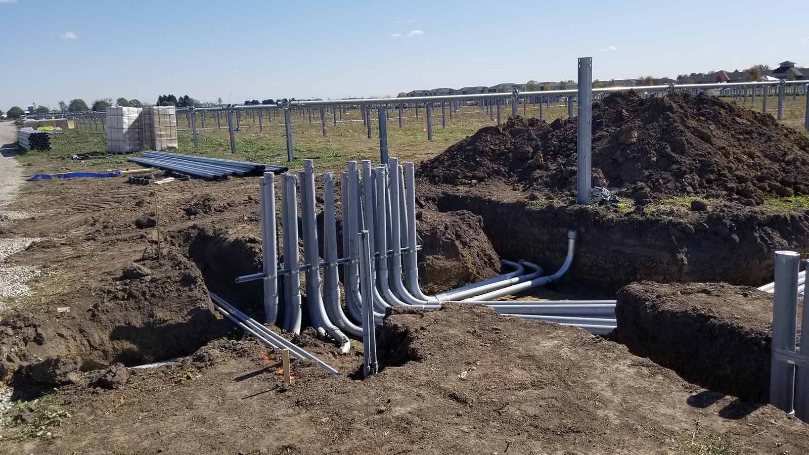 view one of conduit during installation phase under a solar panel