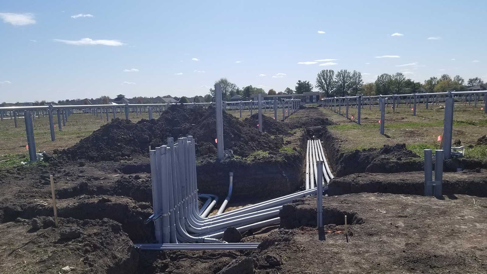 view two of conduit during installation phase under a solar panel