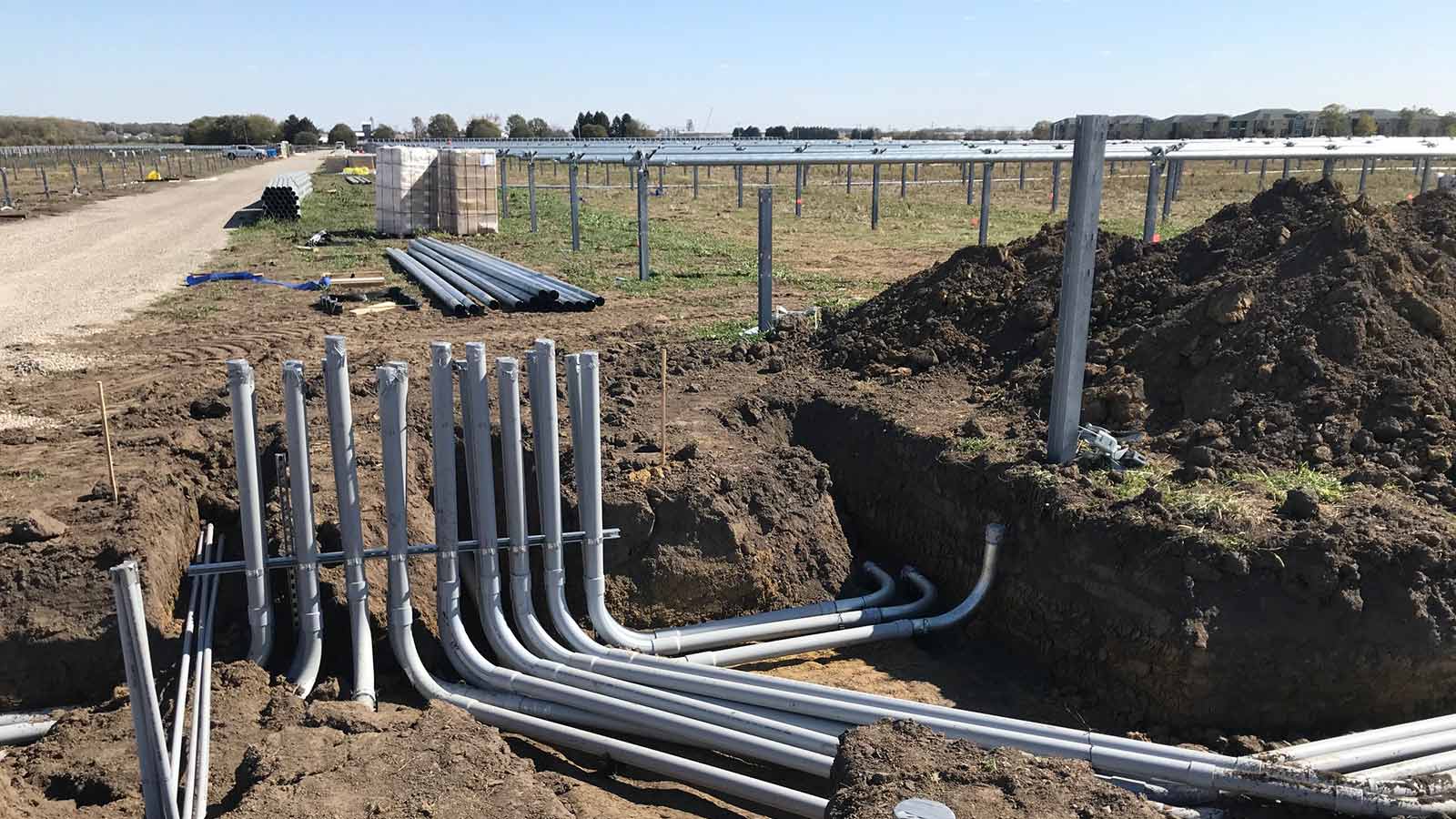 view four of conduit during installation phase under a solar panel