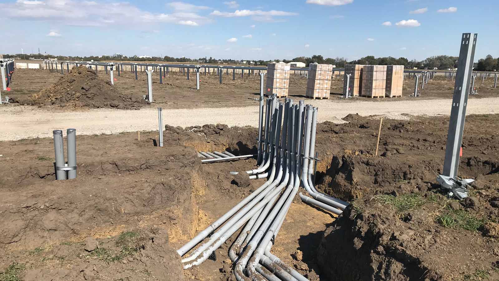 view five of conduit during installation phase under a solar panel