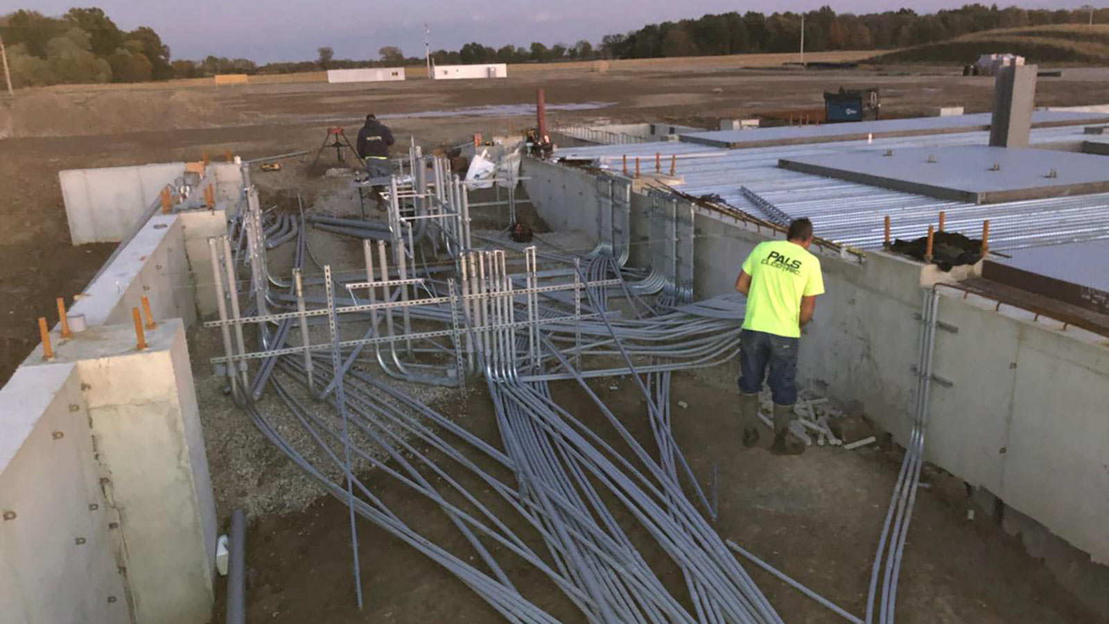 Pal's Electricians working along the foundation of the Indiana Feed Mill