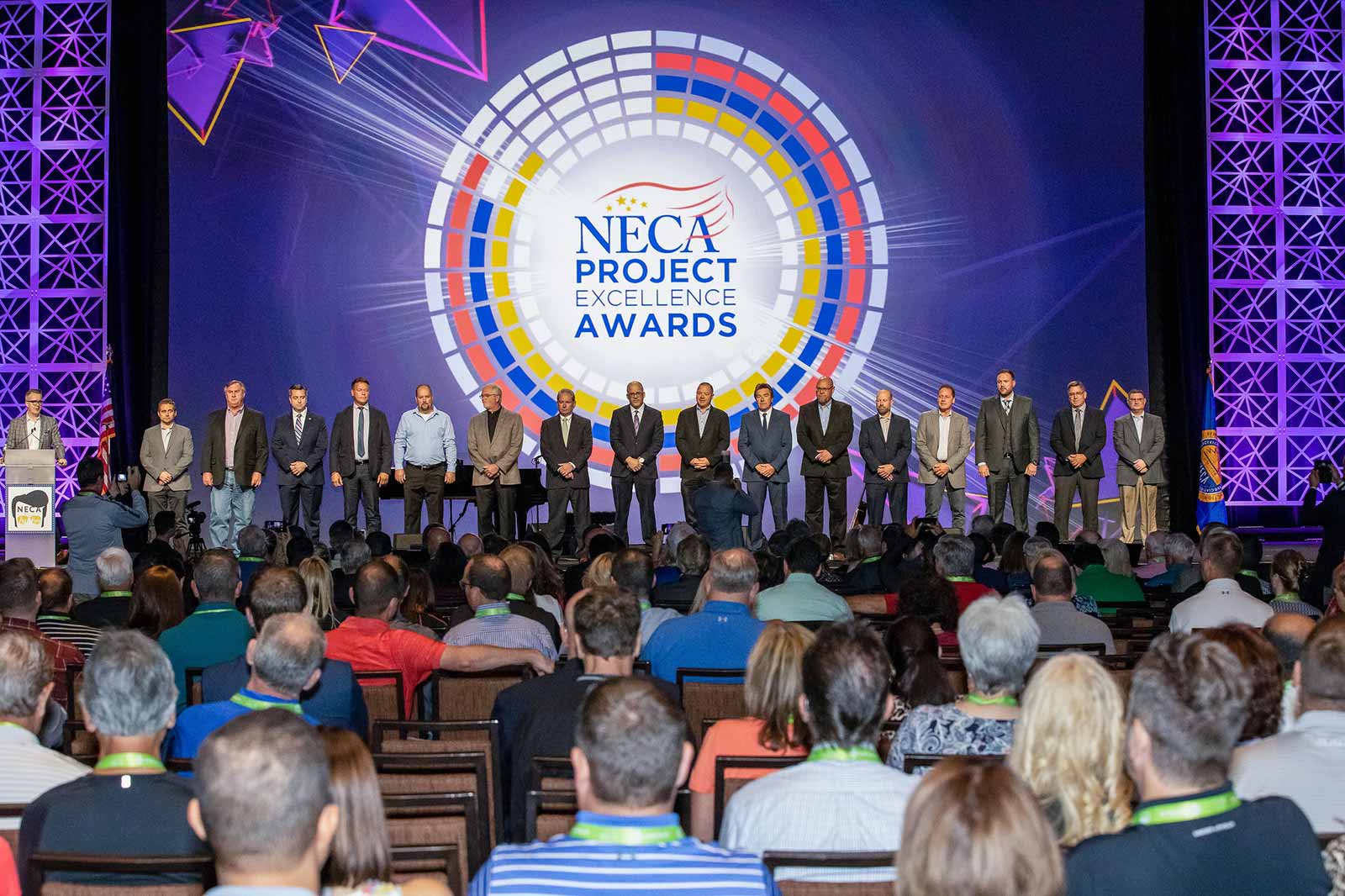 Matt Pals standing with other winners of the N E C A Excellence Award